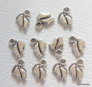 Silver tone new born baby feet charms x 11